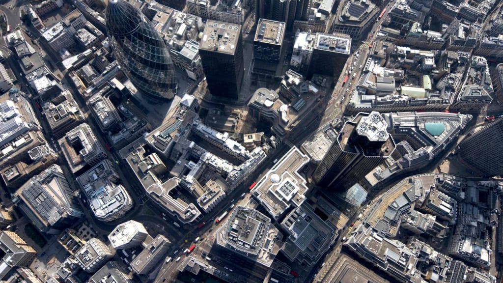Aerial view south of 30 St. Mary Axe, Tower 42, 99 Bishopsgate, Lloyd's building and urban offices.