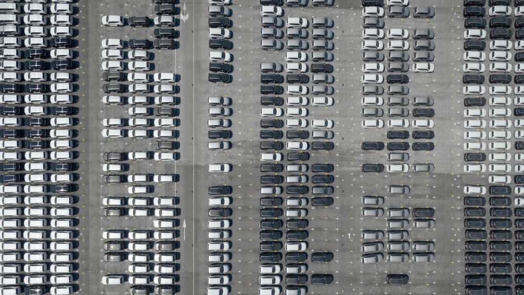 Parking lot with hundreds of cars