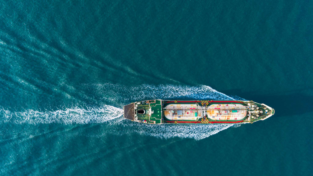 Aerial View of LPG Tanker Ship in Full Speed with Ocean Waves