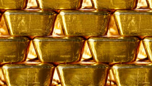 A close-up of several gold bars stacked on top of each other