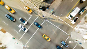 Aerial view of a busy intersection with heavy traffic, illustrating urban transport and mobility.