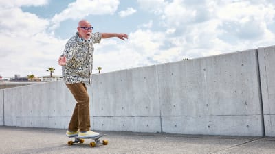 Senior riding a skateboard