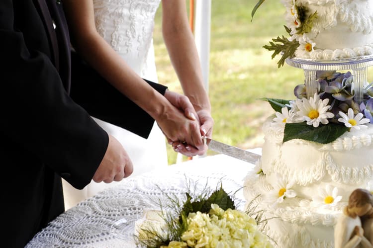 Wedding couple cutting cake