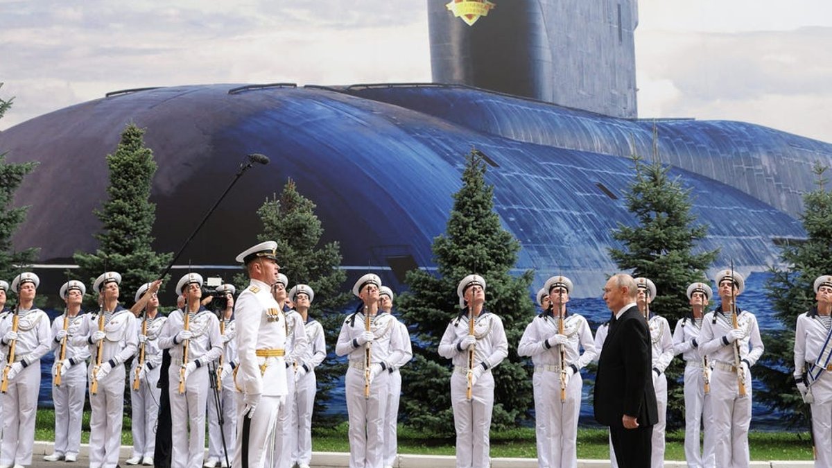 Russia swaps warships for submarine poster at Navy Day - russia navy
