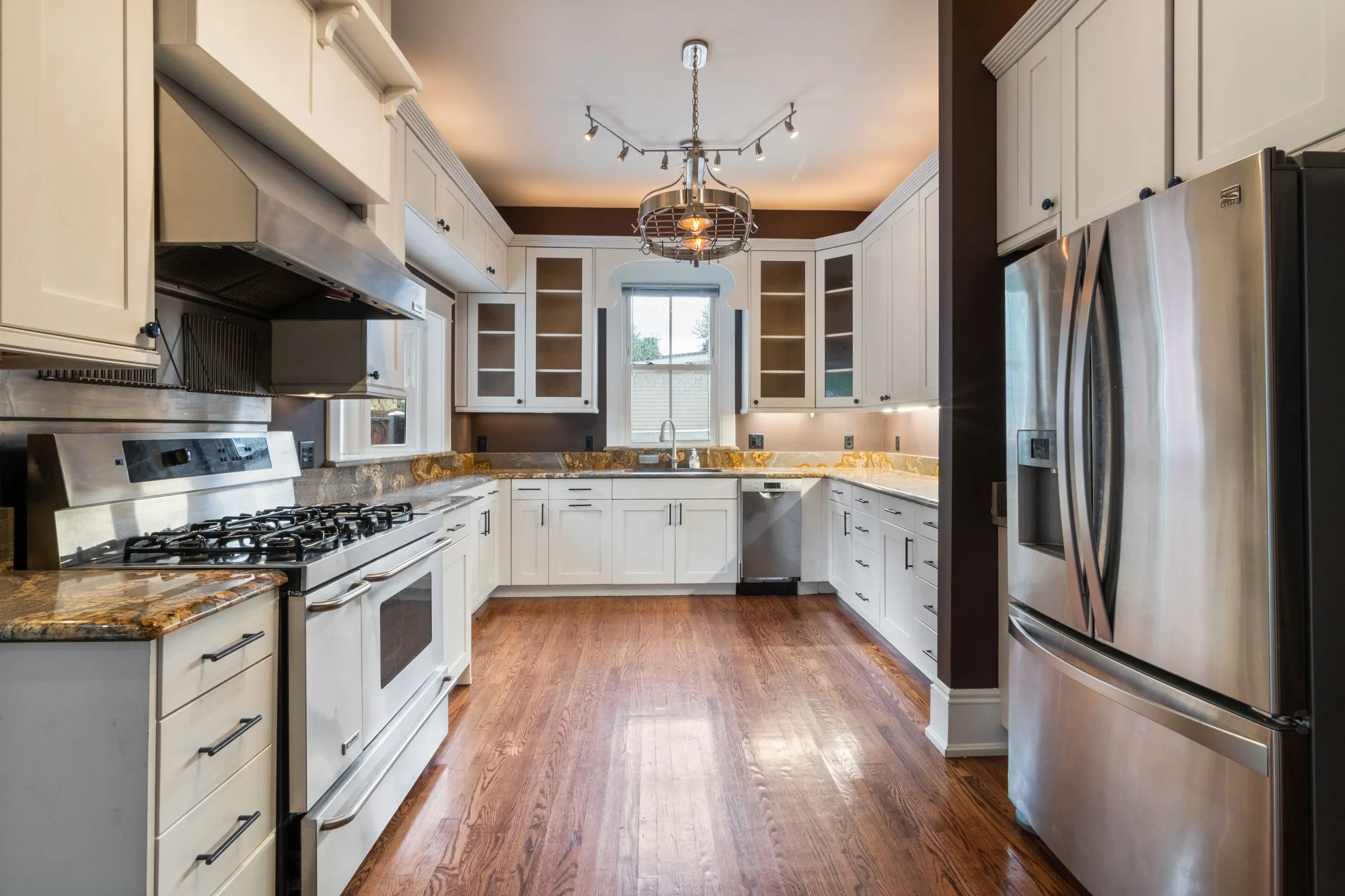 Modern kitchen fitted with stainless-steel home appliances