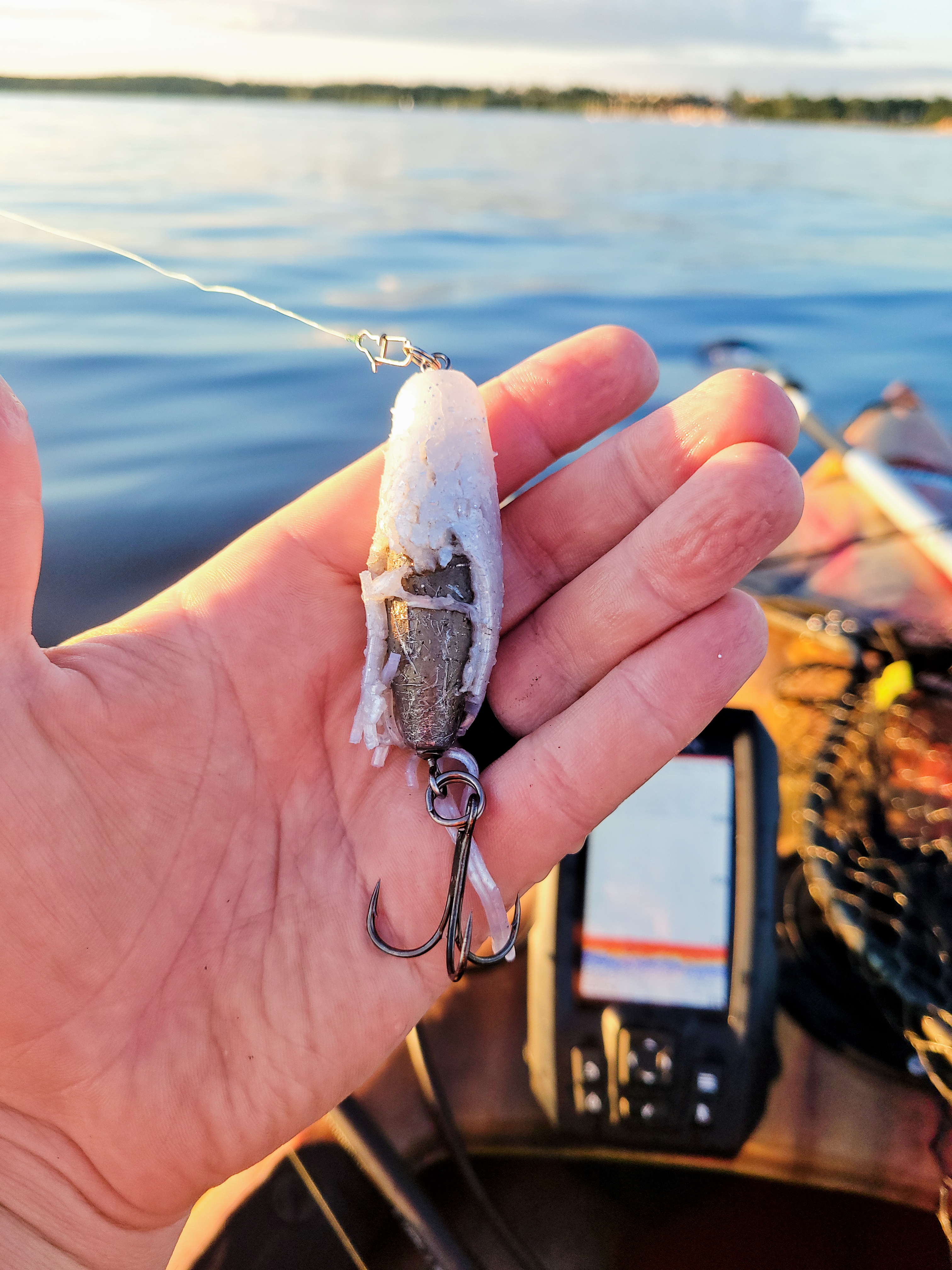 A tube jig with battle damage reveals the inner barrel weight after catching several Lake Trout