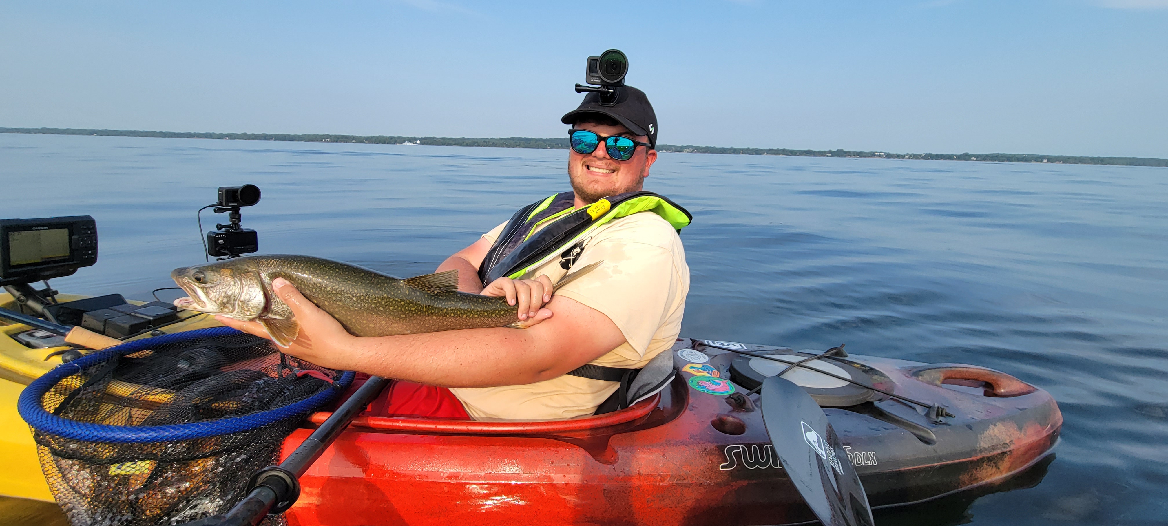 Hunter from Saratoga Outdoors cheeses for the camera after a long day of hunting the wolf pack