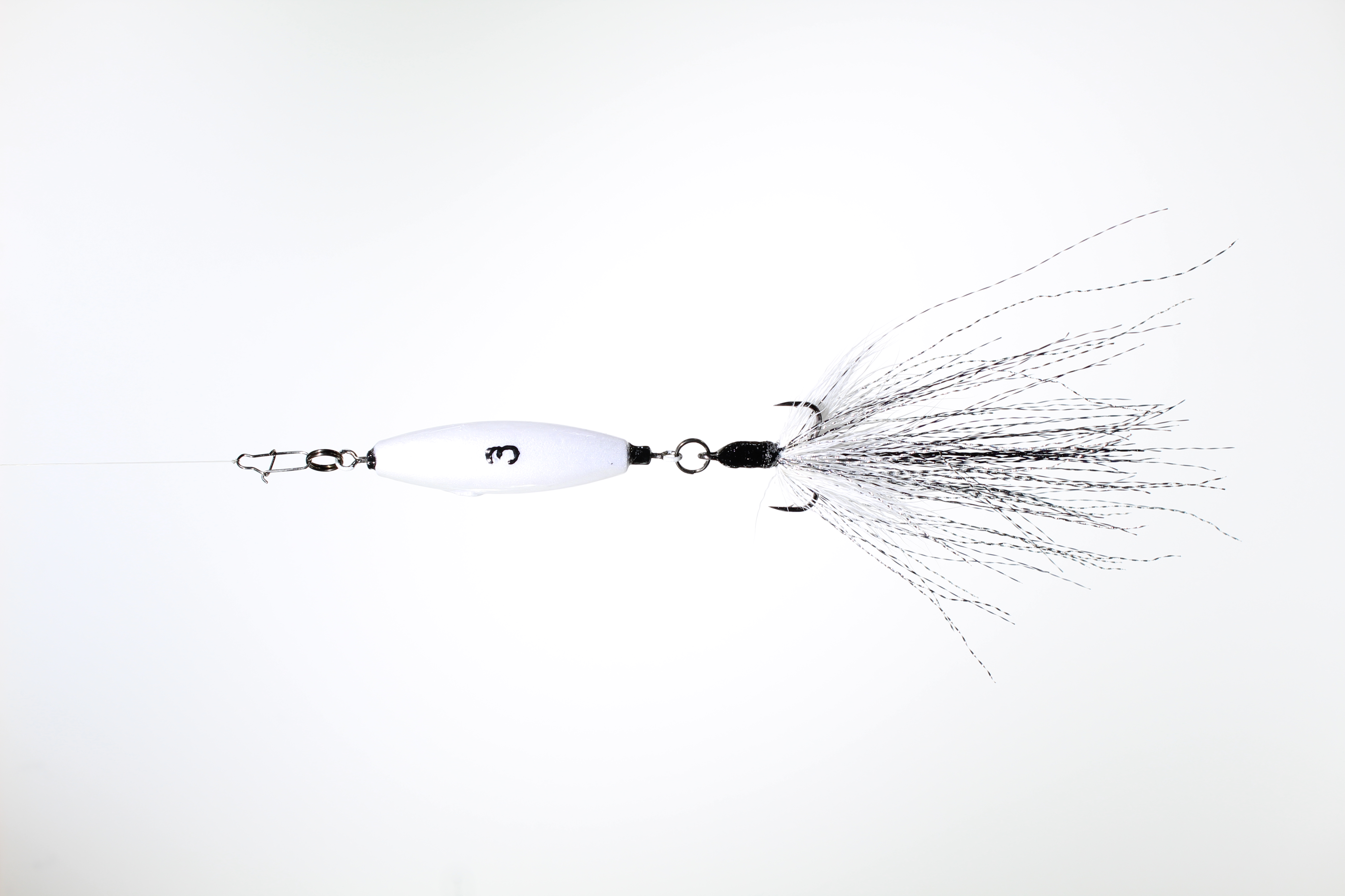 A 3oz VTJ in silver pearl with a white, black and silver dressed treble hook