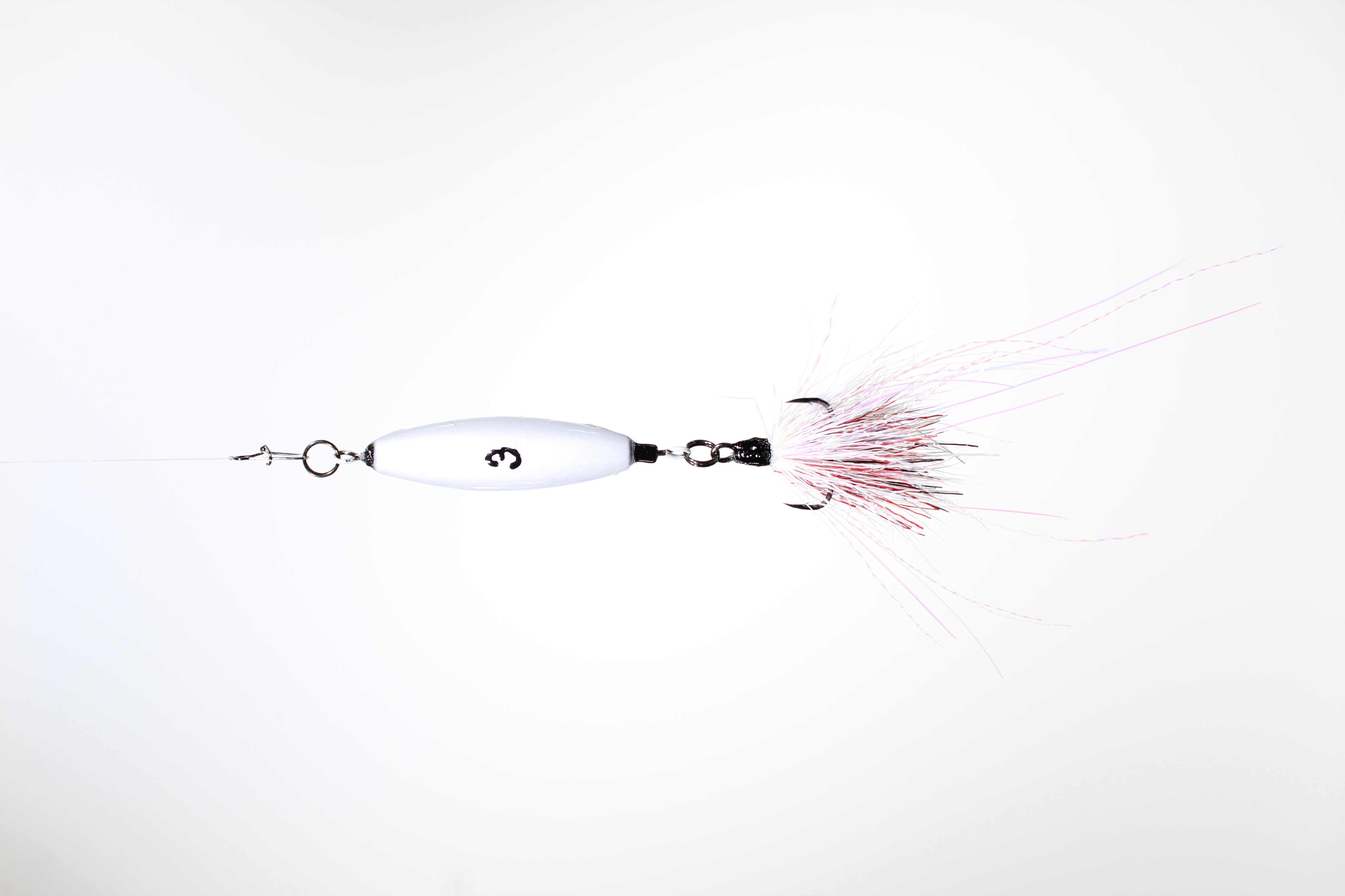 A 3oz VTJ in silver pearl with a white, red and black dressed treble hook