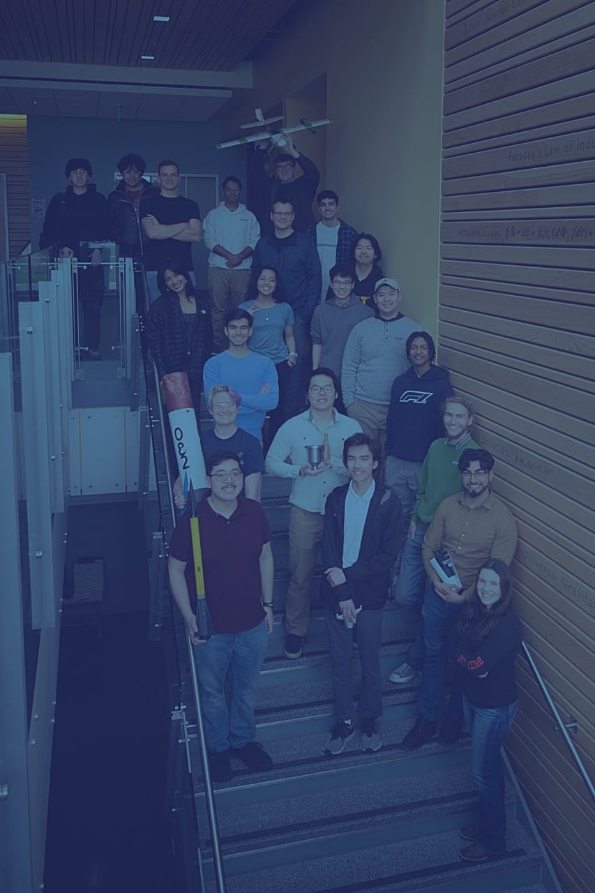 AIAA students gathered with an aerospace project