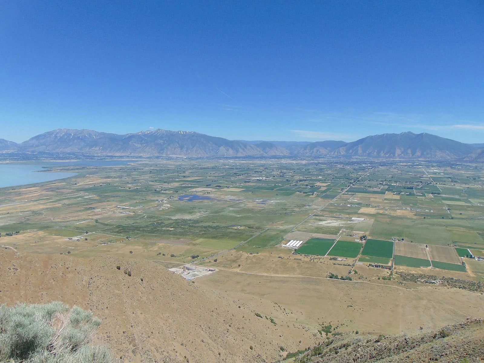 Utah Lake and the farmed floor of southern Utah Valley with the Wasatch Range rising along the far side