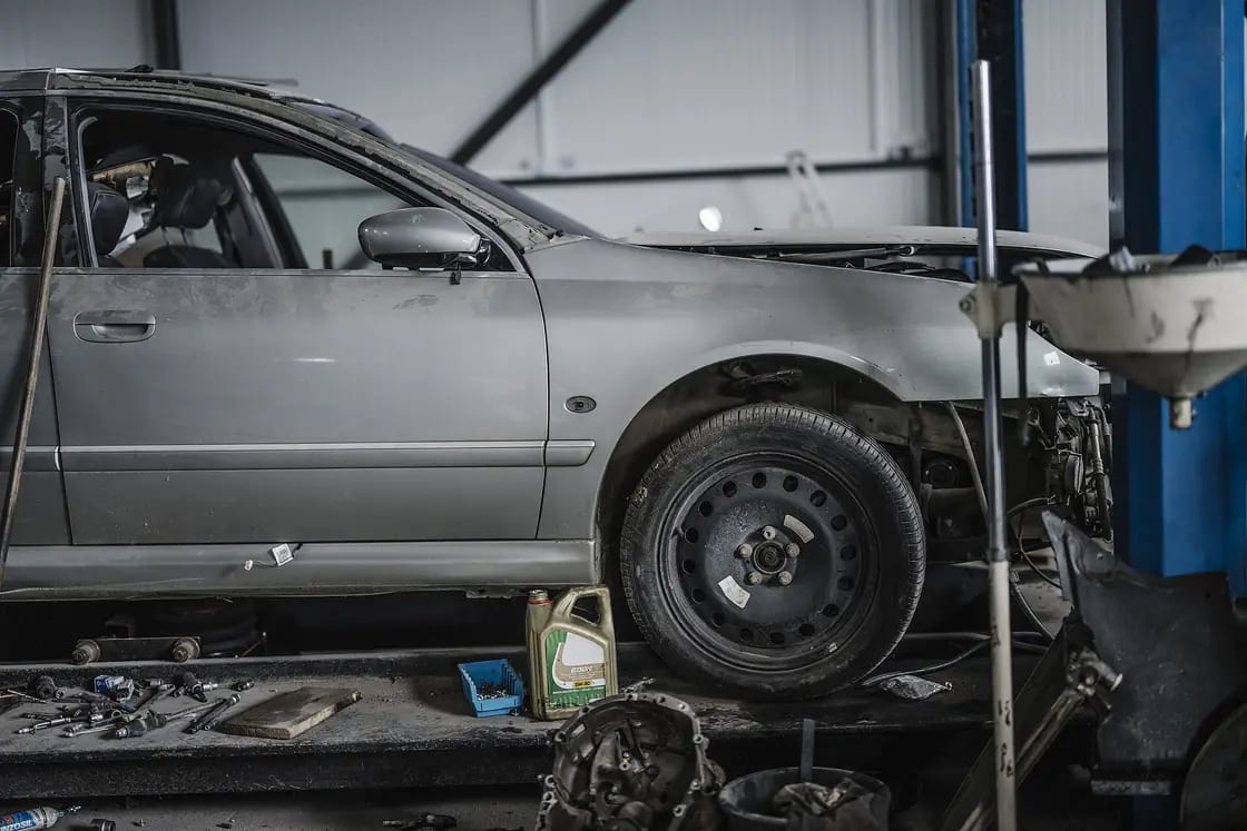 Car being repaired in an auto shop