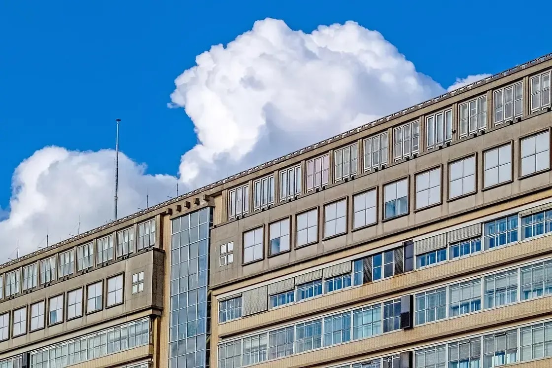 A large institutional building with long rows of windows