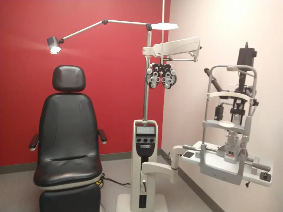 An optometry exam room with vision-testing equipment — LASIK and vision correction in Utah Valley