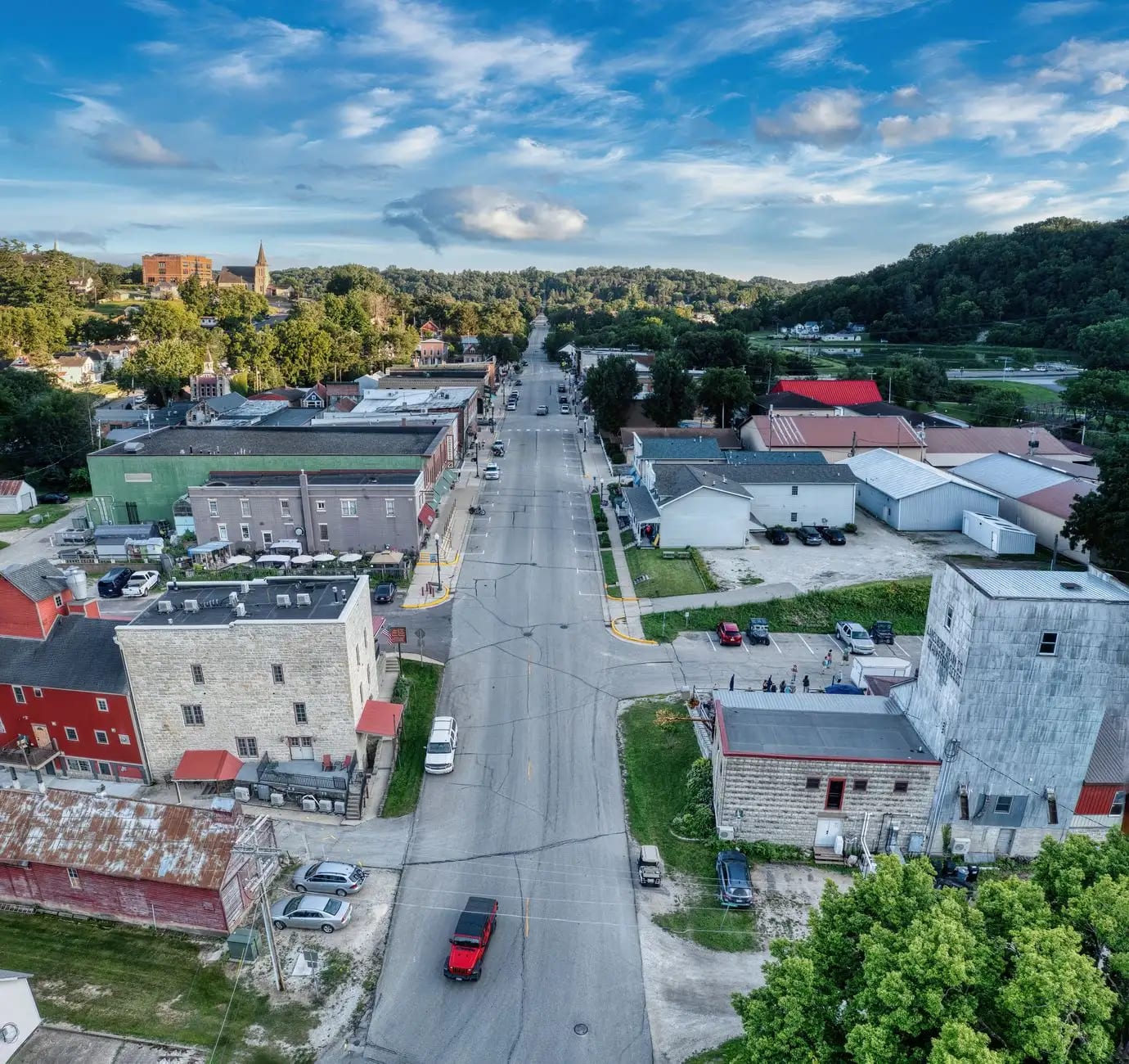 An aerial view of a small town ringed by farmland