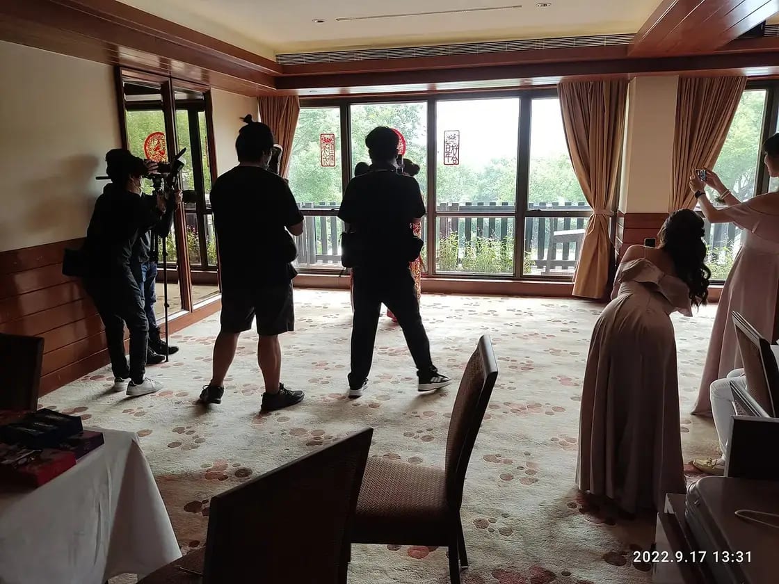 Photographers with cameras capturing a wedding — choosing a wedding photographer in Utah Valley