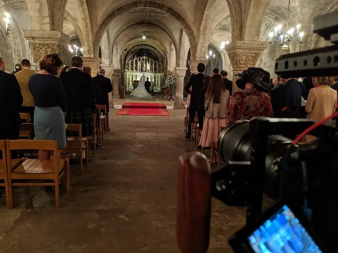 A wedding videographer filming a ceremony — wedding videographers in Utah Valley