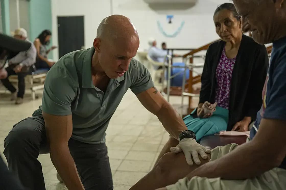 A physical therapist guiding a patient through rehabilitation exercises — chiropractic and physical therapy in Utah Valley