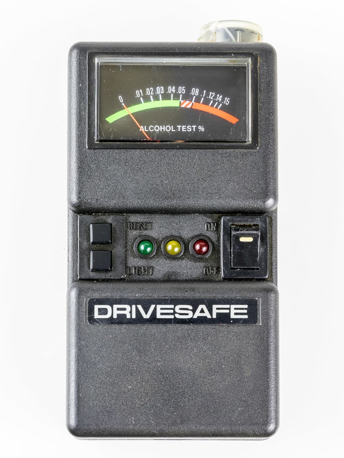 A handheld analog alcohol testing device with a needle gauge marked ALCOHOL TEST and colored indicator lights