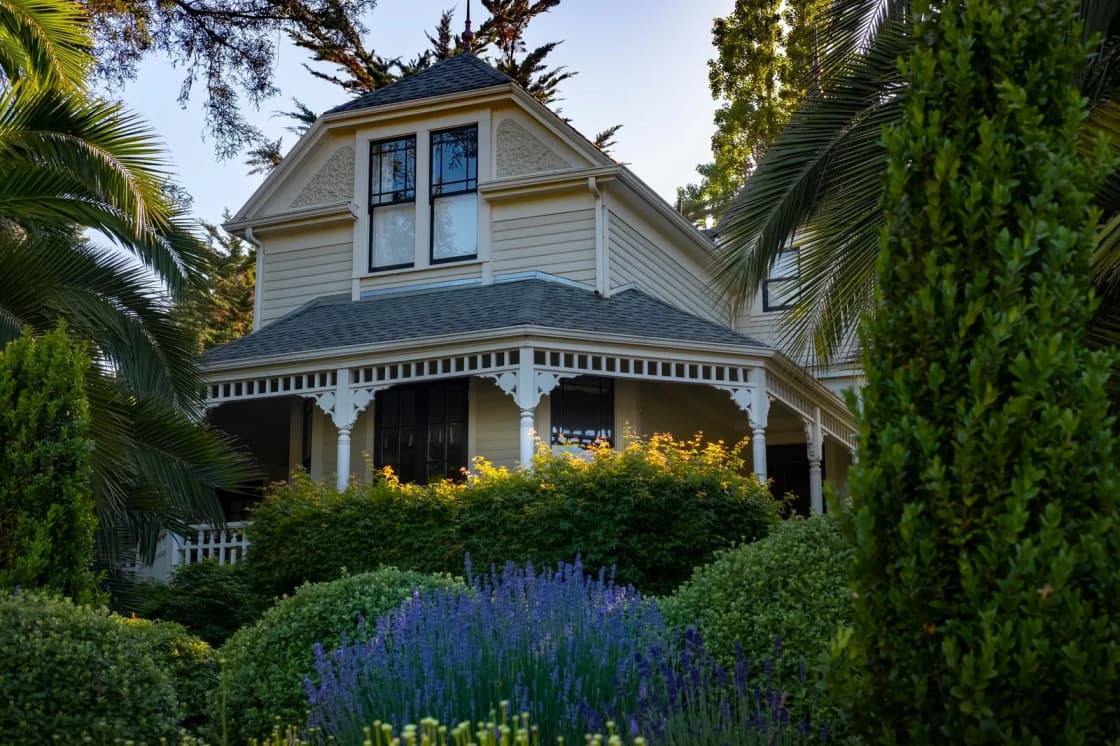 A Victorian house with decorative trim and a covered porch
