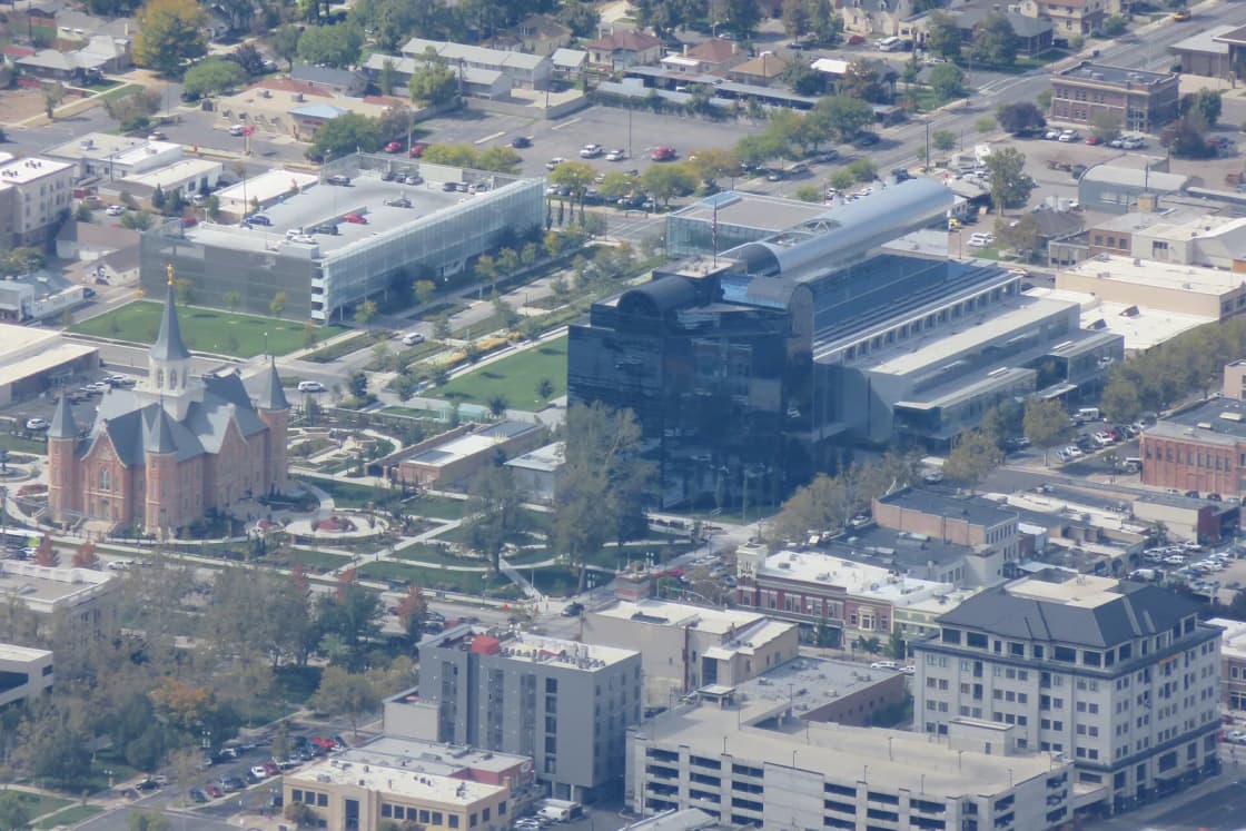 Aerial view of downtown Provo, Utah, with the Provo City Center Temple and the glass convention center.