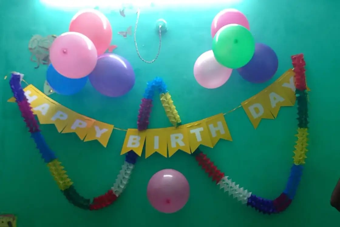 Kids celebrating a birthday party with balloons and cake in the Provo, Utah area