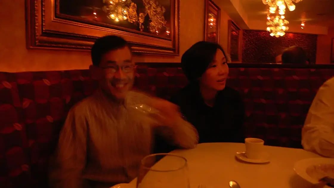 Family with kids sharing a meal at a restaurant table in the Provo, Utah area