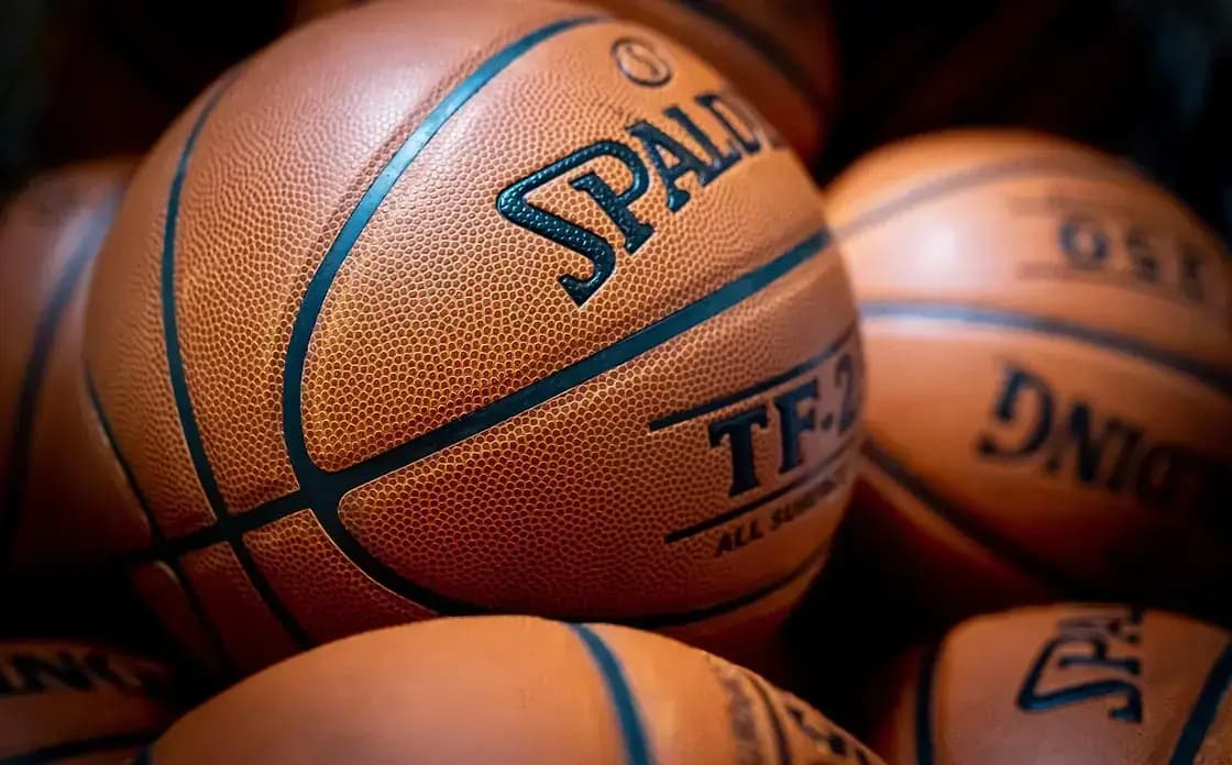 Close-up of a basketball on an indoor hardwood court