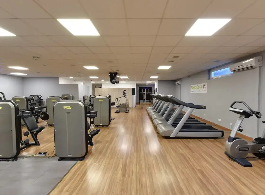 Treadmills and weight machines in a fitness room