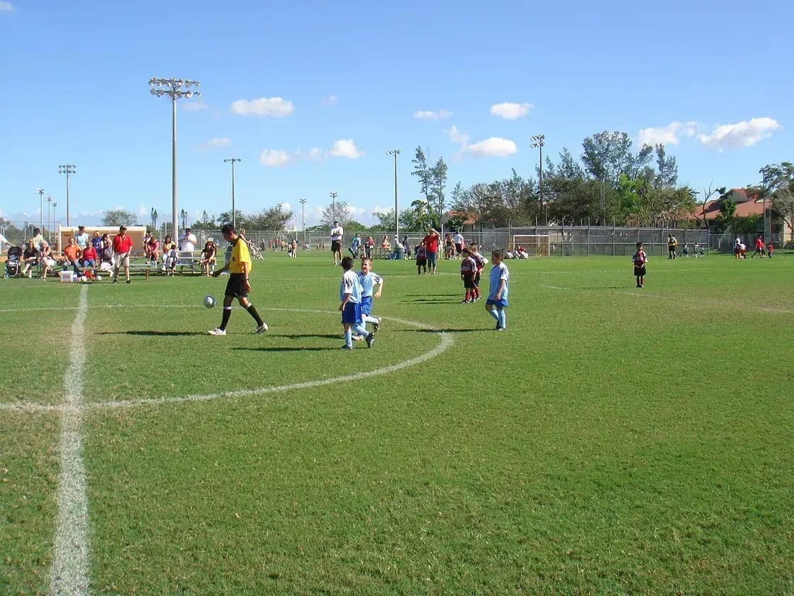 Youth soccer players competing on a grass field