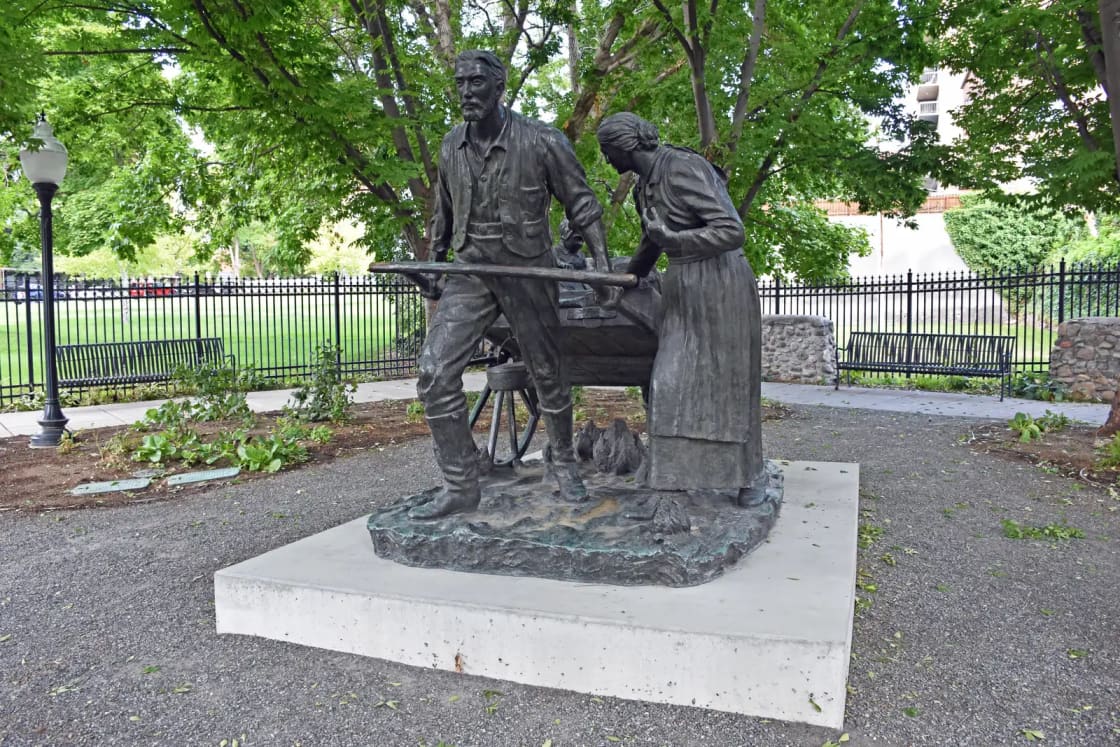 The Handcart Pioneers sculpture, figures leaning into a loaded handcart