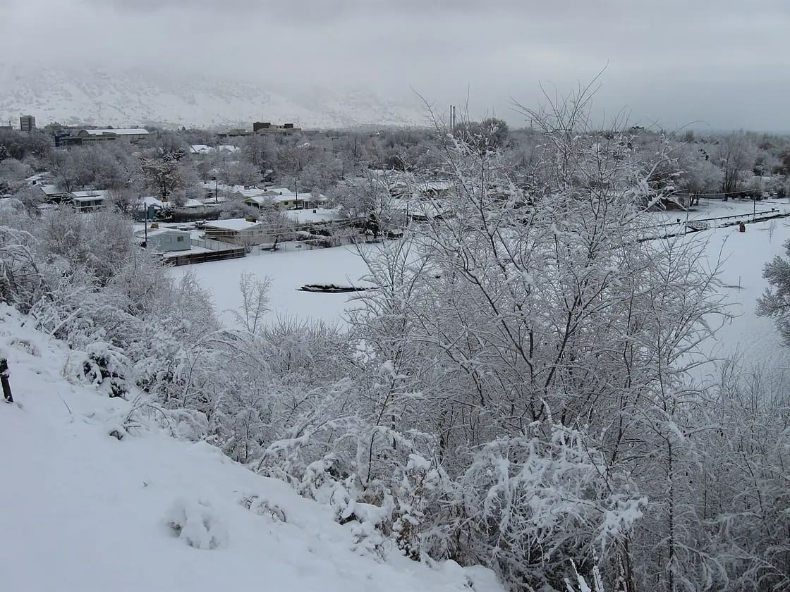 Provo and Utah Valley under a winter sky, with the Wasatch Range rising above the valley floor