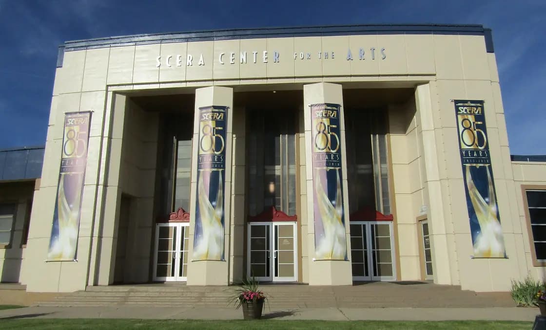 The art deco entrance of the SCERA Center for the Arts in Orem, with banners marking the organization's 85th anniversary