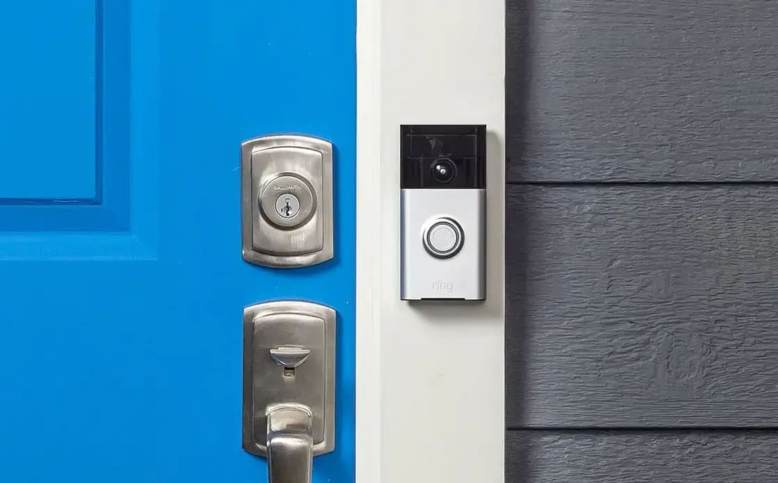 A door-to-door sales representative approaching a suburban home