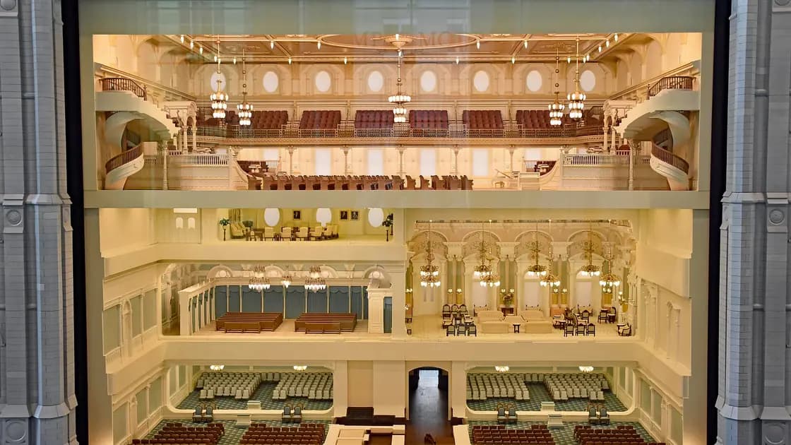 A cutaway scale model of the Salt Lake Temple showing its lit interior rooms, on display in the Temple Square Visitors' Center