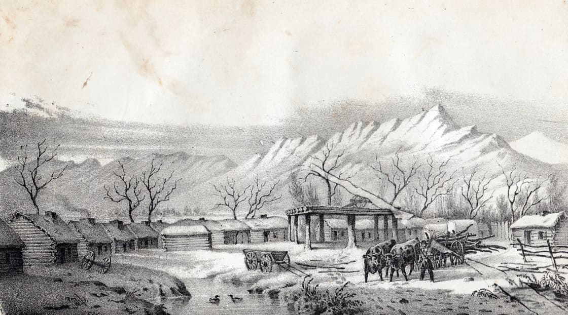 A nineteenth-century lithograph titled Fort Utah on the Timpanogas, showing a row of log cabins and a raised timber lookout beside a river in winter, with snow-covered Wasatch peaks behind