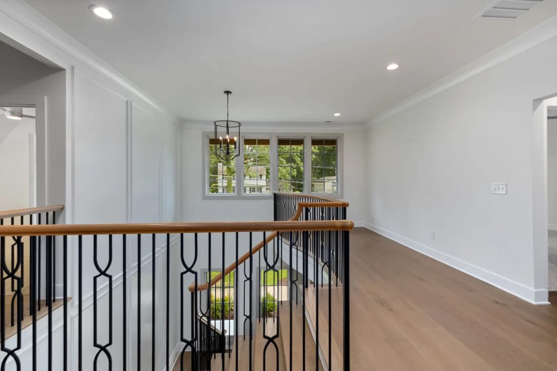 Spacious and elegant landing in a modern home with a view outside