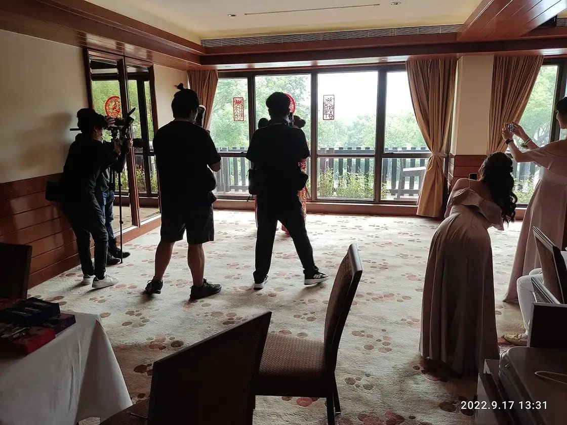 Photographers with cameras capturing a wedding — choosing a wedding photographer in Utah Valley