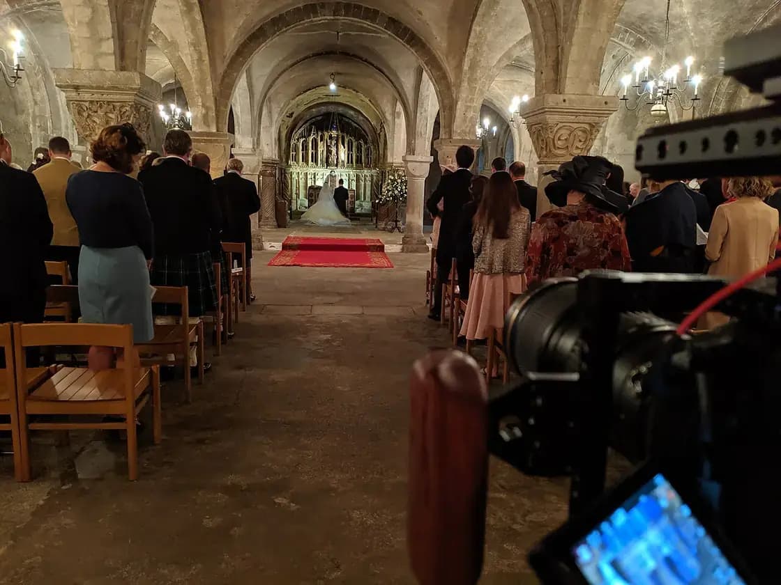 A wedding videographer filming a ceremony — wedding videographers in Utah Valley