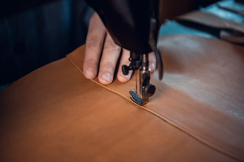 A machine lock stitch — perfectly flat and mathematically uniform.