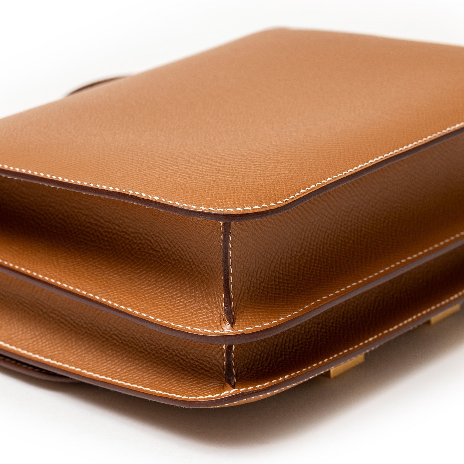 Epsom's rigid, cross-hatched emboss — sharp, structured and effortlessly durable.