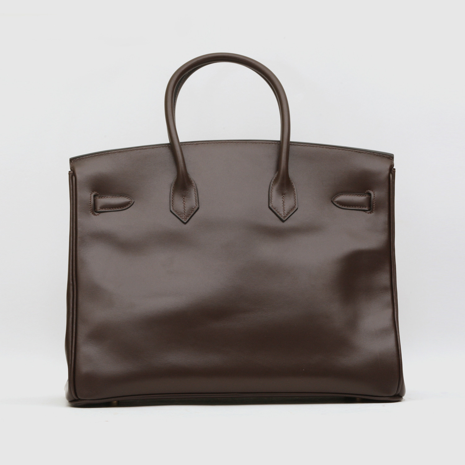 Years of light and touch: Box mellows into a deep, chocolate patina.