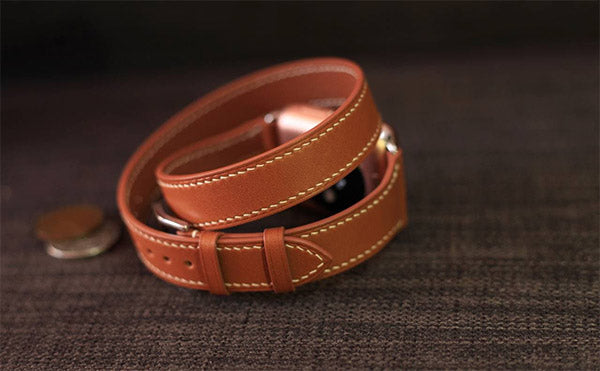 Barénia beyond bags: the same hide wrapped around a watch strap, patinating with daily wear.