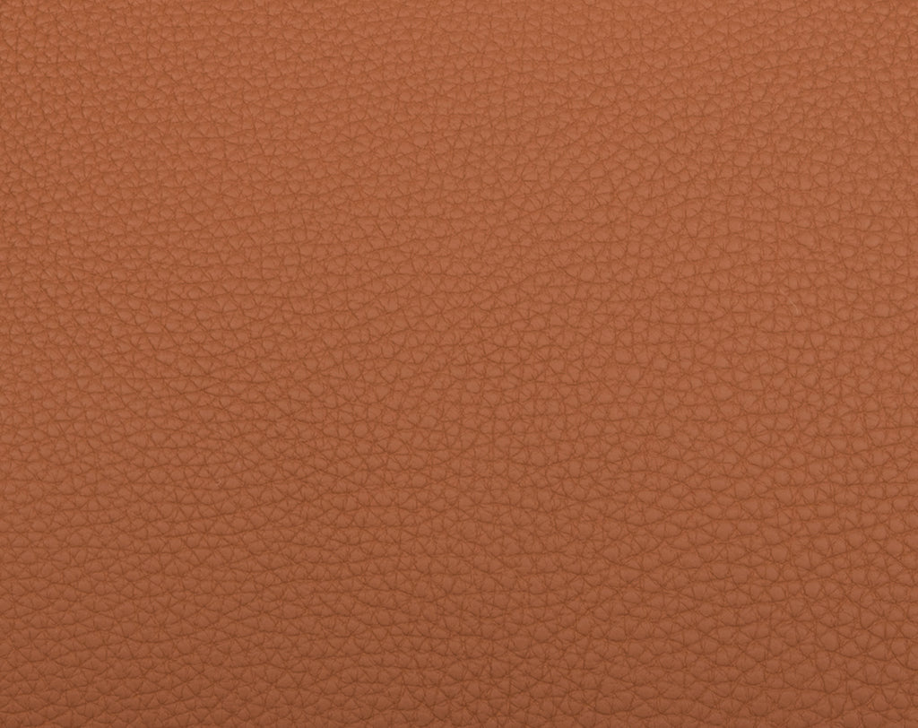 Togo calfskin, photographed under the same conditions: a pronounced, irregular pebbled grain that Swift deliberately does not have.