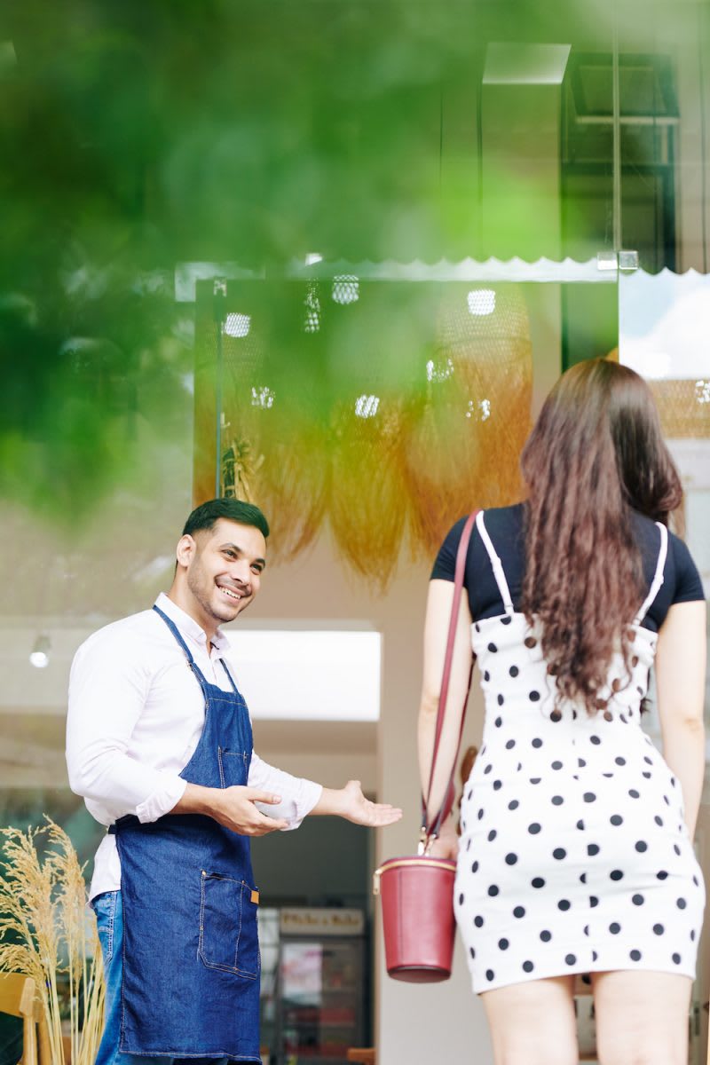 10 Reasons Why one should develop his/her own Website. 2 shop owner inviting customer XE9M7NZ e1610892497552