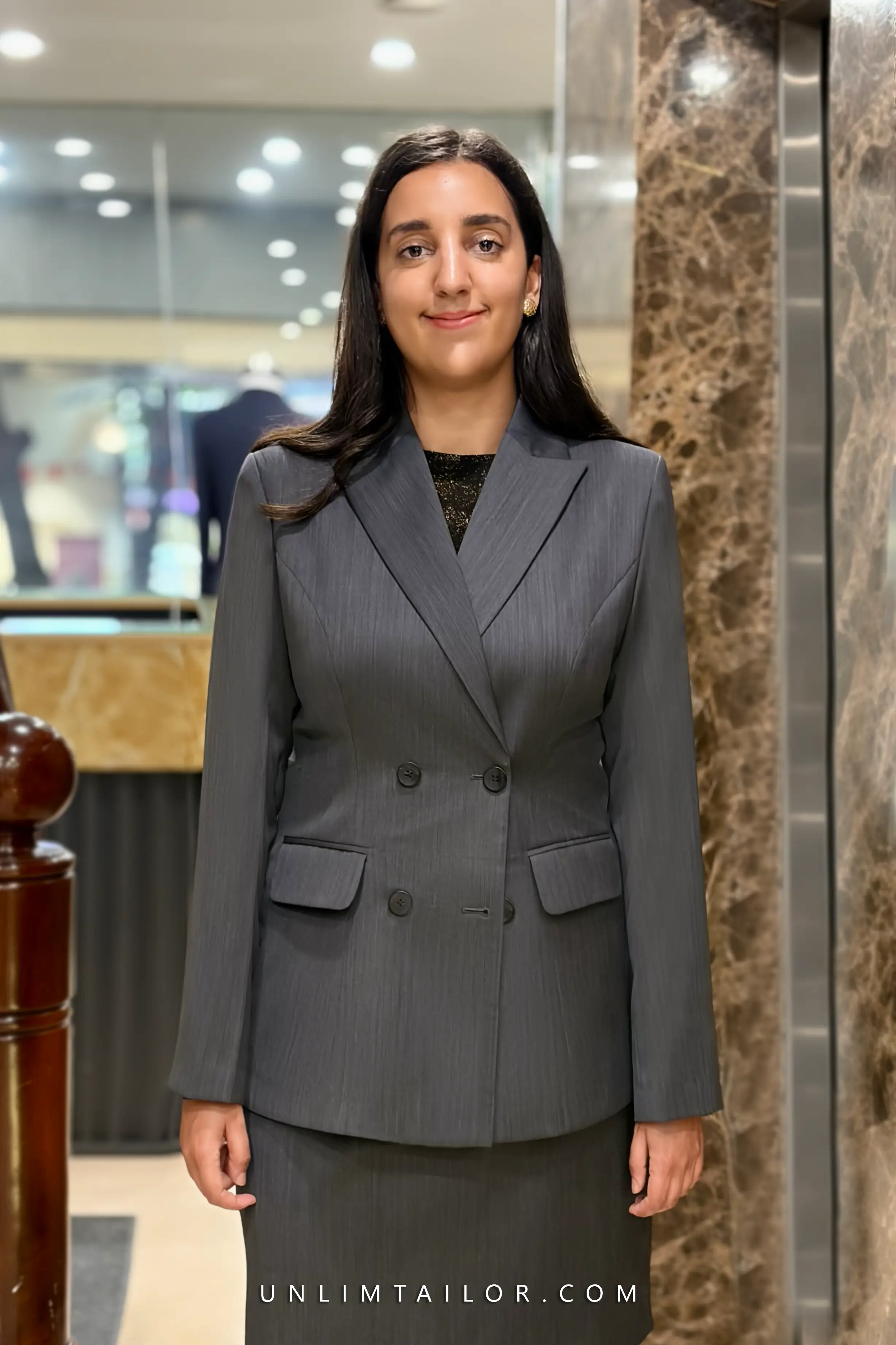A two-piece, two-button women’s suit in deep navy blue, tailored by Unlim Tailor Hanoi. - detail images