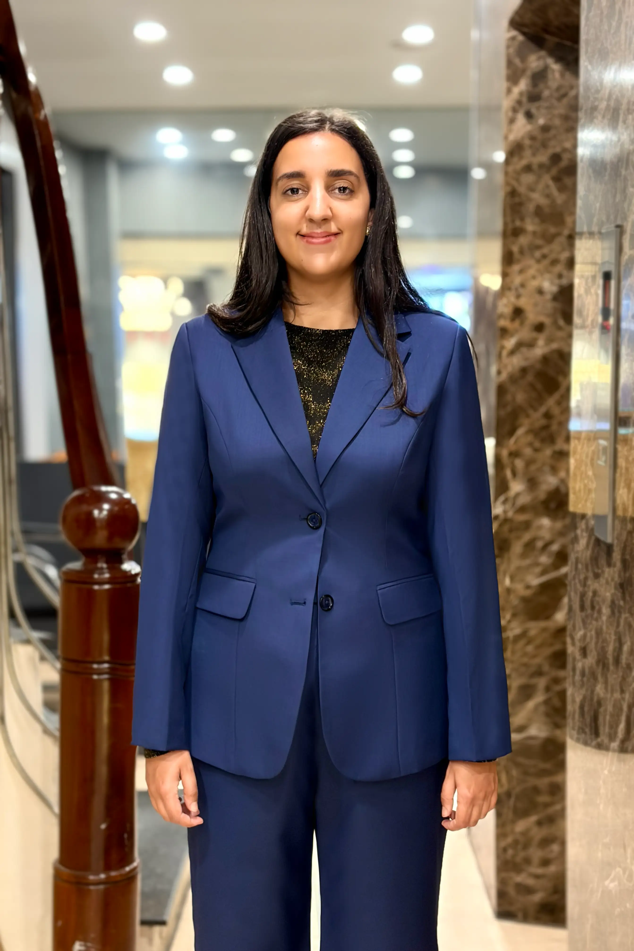 A two-piece, two-button women’s suit in deep navy blue, tailored by Unlim Tailor Hanoi. - detail images
