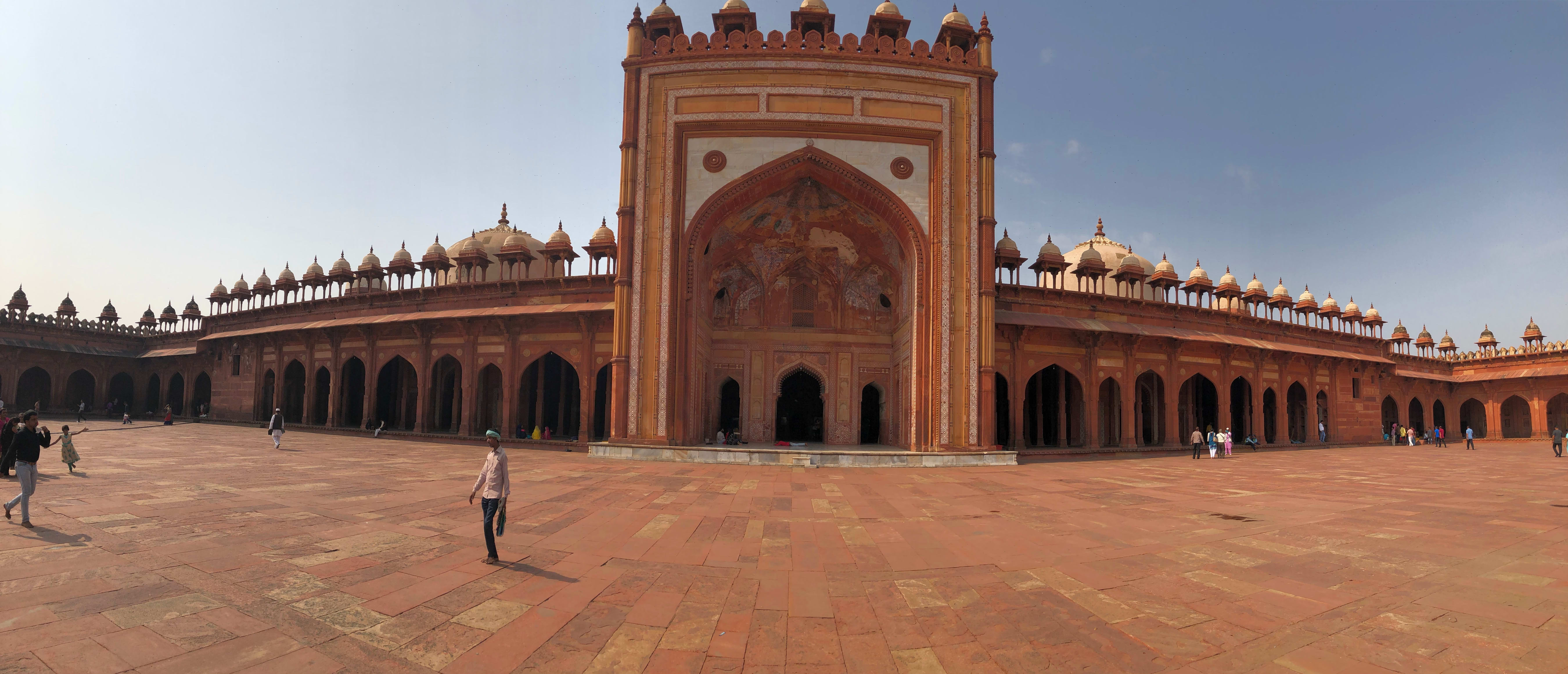 Wide view across the red sandstone arches of the Jama Masjid prayer hall, Fatehpur Sikri.