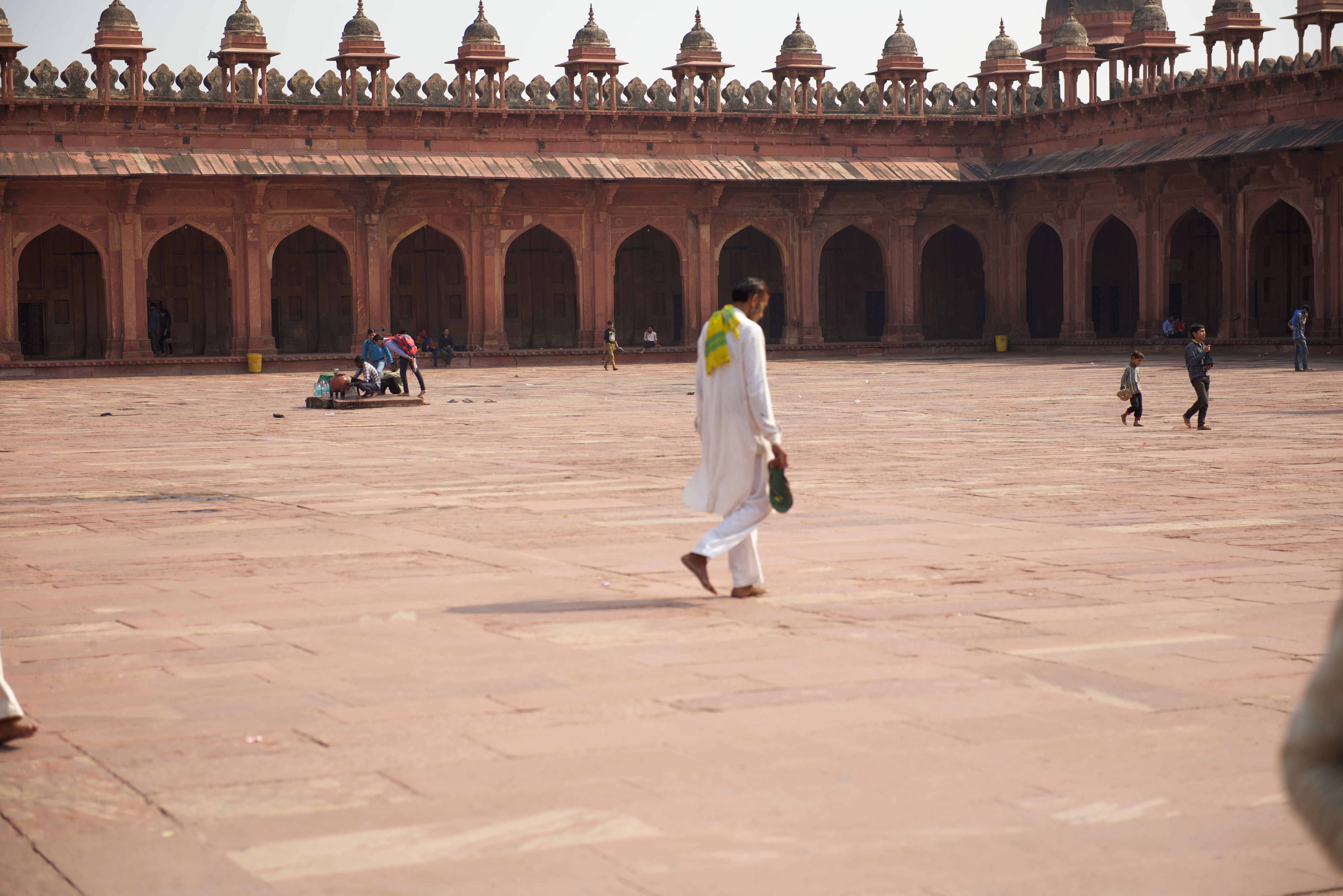 Visitors and sandstone architecture at Fatehpur Sikri.