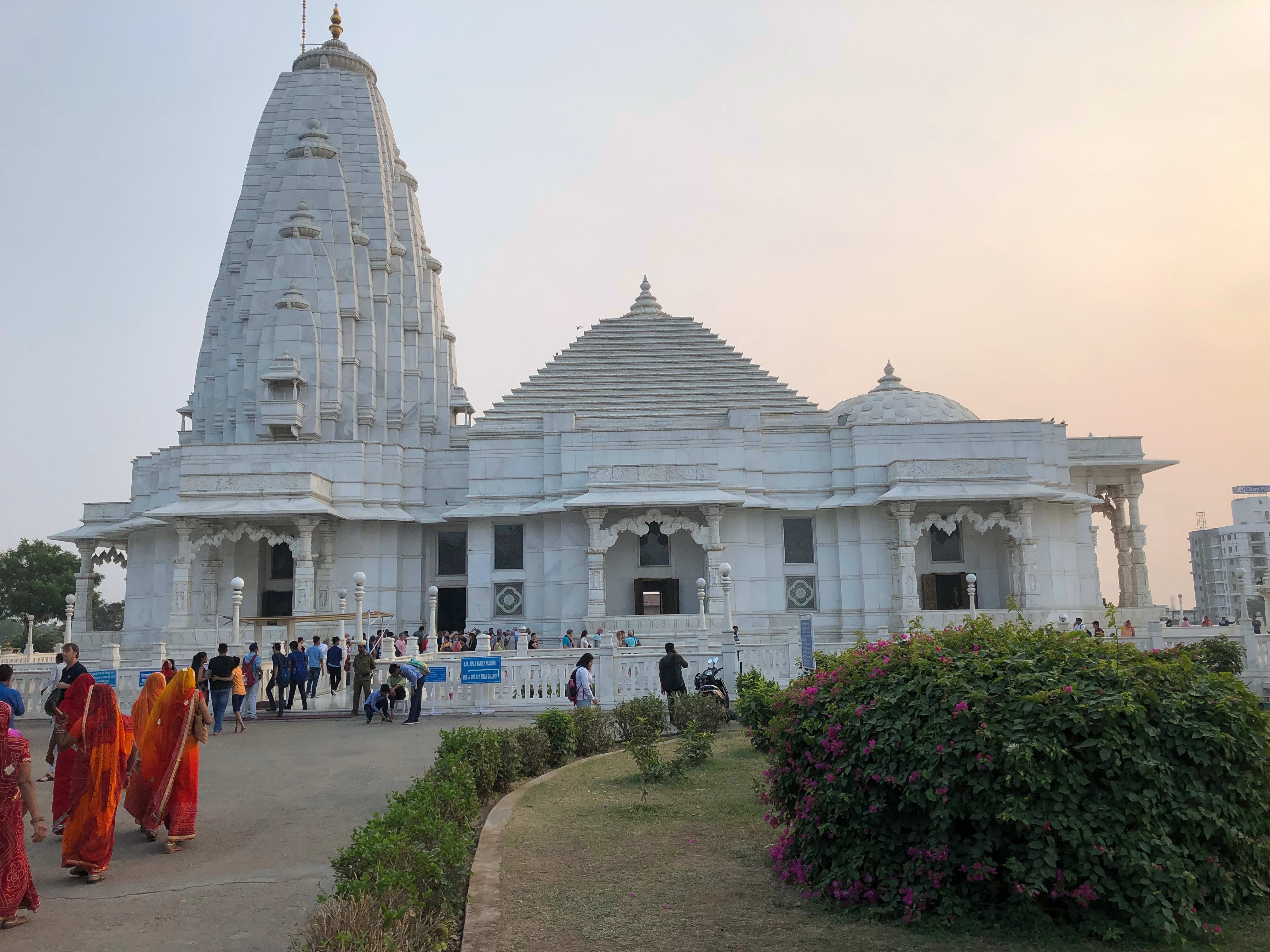 Visitors near the white stone structure of Birla Mandir in Jaipur.